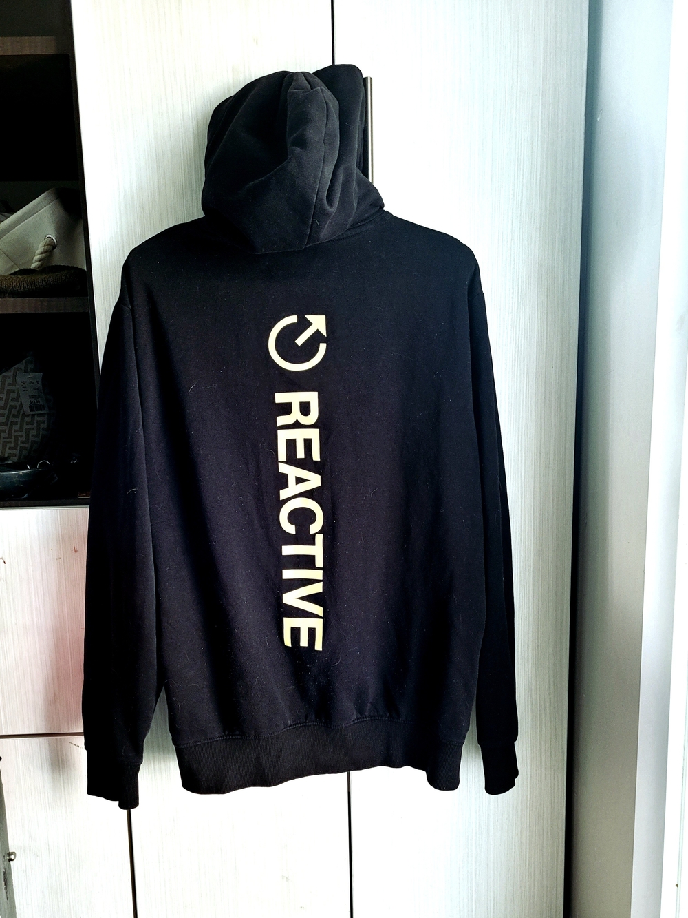 Kenneth Cole Black Hoodie with Vertical Cream REACTIVE Logo